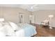 Bright bedroom offers hardwood floors, and ample natural light, creating a warm and inviting atmosphere at 9059 Se 177Th Grassmere St, The Villages, FL 32162