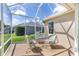 Enclosed patio offers an outdoor seating area with privacy at 9059 Se 177Th Grassmere St, The Villages, FL 32162