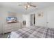 Bedroom with ensuite bathroom and dining room featuring a ceiling fan at 9321 Se 172Nd Augusta Ln, The Villages, FL 32162