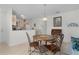 Cozy dining area with tile flooring, seating for four, and an open view of the kitchen at 9321 Se 172Nd Augusta Ln, The Villages, FL 32162