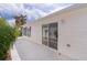 Side exterior with concrete patio, offering outdoor living, and access to the home's interior at 9321 Se 172Nd Augusta Ln, The Villages, FL 32162