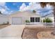 Charming single-story home with a well-maintained front yard, concrete driveway, and attached garage at 9321 Se 172Nd Augusta Ln, The Villages, FL 32162