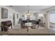 The open concept living and dining area offers generous seating and an airy atmosphere at 9321 Se 172Nd Augusta Ln, The Villages, FL 32162