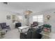 Bright living room showcasing neutral walls, ceiling fan, and comfortable seating arrangements at 9321 Se 172Nd Augusta Ln, The Villages, FL 32162