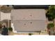Image showing the roof and surrounding area; shrubs, palm trees and a well-kept property at 9321 Se 172Nd Augusta Ln, The Villages, FL 32162