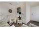 Cozy sunroom with wicker furniture, tile floor, and a ceiling fan at 9321 Se 172Nd Augusta Ln, The Villages, FL 32162