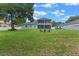 Expansive backyard offers seating and a boat, ideal for relaxation and outdoor activities at 9512 Mid Summer Ln, Leesburg, FL 34788