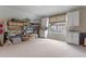 Bonus room featuring a large window, built-in cabinets, and plenty of storage space at 9512 Mid Summer Ln, Leesburg, FL 34788