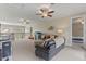 Upstairs bonus room featuring plenty of space for , a view of the lake, and a separate lounge area at 9512 Mid Summer Ln, Leesburg, FL 34788