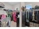 Bright walk-in closet featuring ample storage and shelving, providing organized space for clothing and accessories at 9512 Mid Summer Ln, Leesburg, FL 34788