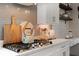 Close up view of a modern kitchen featuring sleek countertops, and subway tile backsplash and stainless steel appliances at 9512 Mid Summer Ln, Leesburg, FL 34788