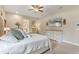 Beautiful bedroom featuring a bed, two dressers and mounted television at 9512 Mid Summer Ln, Leesburg, FL 34788