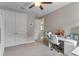 Bright home office features neutral walls, carpet flooring, and large closet space for efficient storage at 9512 Mid Summer Ln, Leesburg, FL 34788