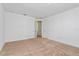Cozy bedroom with neutral carpet, light walls, and multiple doors, offering a peaceful retreat at 9674 Rodbell St, Orlando, FL 32827