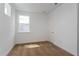 Cozy bedroom with neutral carpet, a bright window offering natural light, and a minimalist style at 9674 Rodbell St, Orlando, FL 32827