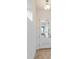 Bright entryway featuring a white door with glass panels and a view to a blue front door at 9674 Rodbell St, Orlando, FL 32827