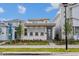 Charming modern home featuring a stylish blue front door, complemented by manicured landscaping at 9674 Rodbell St, Orlando, FL 32827