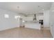 Bright, open kitchen with stainless steel appliances, a pendant light, and white cabinetry at 9674 Rodbell St, Orlando, FL 32827