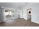 Large bedroom with wood floors, access to outdoor patio, and an ensuite bathroom at 997 Oscar Ln, The Villages, FL 32162