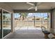 Spacious screened-in patio with ceiling fan and outdoor seating at 997 Oscar Ln, The Villages, FL 32162