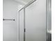 Modern glass enclosed walk-in shower with chrome fixtures at 997 Oscar Ln, The Villages, FL 32162