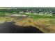High aerial view of dark waters with vegetation along the shore at 101 Lakeshore Blvd, St Cloud, FL 34769