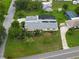 Well-kept home with lush lawn, screened-in pool, and mature landscaping in a quiet neighborhood at 101 Lakeshore Blvd, St Cloud, FL 34769