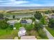 Aerial view featuring the house with its pool and waterway in the background at 101 Lakeshore Blvd, St Cloud, FL 34769
