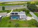 A high aerial view of the property featuring a screened-in pool and waterfront views at 101 Lakeshore Blvd, St Cloud, FL 34769