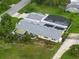 Aerial view showing the roof and enclosed swimming pool of the home at 101 Lakeshore Blvd, St Cloud, FL 34769