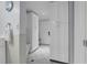 Bathroom featuring white cabinets and tile flooring with a shower and toilet at 101 Lakeshore Blvd, St Cloud, FL 34769