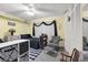 Bedroom featuring black comforter, ceiling fan, and closet at 101 Lakeshore Blvd, St Cloud, FL 34769