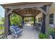 Spacious covered patio with elegant seating and ample space for social gatherings and relaxation at 101 Lakeshore Blvd, St Cloud, FL 34769