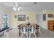 Bright dining space with natural light, white chairs, and views of the outdoors at 101 Lakeshore Blvd, St Cloud, FL 34769