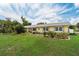 Well-maintained home with an American flag and tasteful landscaping offering great curb appeal at 101 Lakeshore Blvd, St Cloud, FL 34769