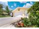 Spacious garage with white door, side entrance, and ample driveway parking at 101 Lakeshore Blvd, St Cloud, FL 34769