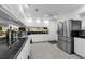 Modern kitchen with stainless steel appliances and white cabinetry for a sleek design at 101 Lakeshore Blvd, St Cloud, FL 34769