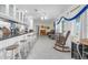 Open-concept living area showcasing a breakfast bar, piano, and comfortable seating at 101 Lakeshore Blvd, St Cloud, FL 34769