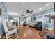 Spacious living room with a brick fireplace, ceiling fans and many seating options at 101 Lakeshore Blvd, St Cloud, FL 34769
