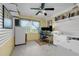 Office with neutral walls, large window, and ceiling fan at 101 Lakeshore Blvd, St Cloud, FL 34769