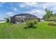 Enclosed in-ground pool, accessible slide, and ample green space for Gathering recreation and relaxation at 101 Lakeshore Blvd, St Cloud, FL 34769