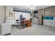 Room with paneled wall, vintage ceiling fan, and linoleum floor at 101 Lakeshore Blvd, St Cloud, FL 34769