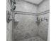 Shower featuring tile walls and stone floor at 101 Lakeshore Blvd, St Cloud, FL 34769