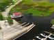 Waterfront aerial view of boat ramp with a paddle wheeler and some watercraft at 101 Lakeshore Blvd, St Cloud, FL 34769