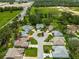 Bird's-eye view of the home and surrounding neighborhood, highlighting the landscaping and backyard features at 1010 Sierra Blanca Ct, Lady Lake, FL 32159
