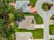 Bird's-eye view of the home and surrounding neighborhood, highlighting the landscaping and backyard features at 1010 Sierra Blanca Ct, Lady Lake, FL 32159
