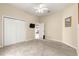 Bedroom with carpet, ceiling fan, and an attached closet at 1010 Sierra Blanca Ct, Lady Lake, FL 32159