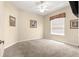 Empty bedroom with carpet floors, ceiling fan, and natural light from the window at 1010 Sierra Blanca Ct, Lady Lake, FL 32159