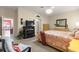 Comfortable bedroom with a fireplace and view to the dining area, creating a relaxing retreat at 1010 Sierra Blanca Ct, Lady Lake, FL 32159