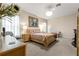 Bright bedroom featuring a decorative chandelier and view of the lush backyard at 1010 Sierra Blanca Ct, Lady Lake, FL 32159